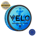 Blue nicotine pouch container with 'VELO' branding on a white background